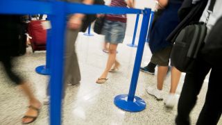 media TSA airport security line summer flip flops